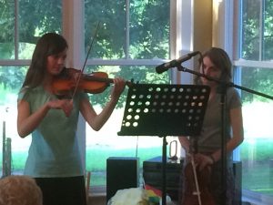 Priscilla and Abby playing violins